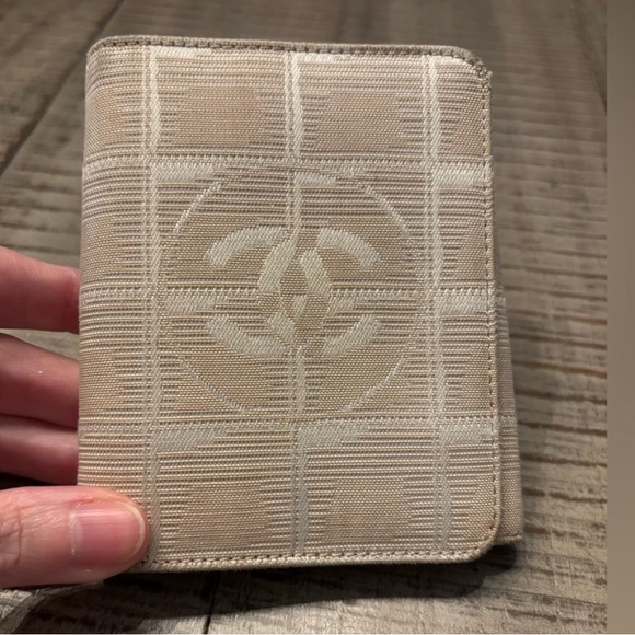 CHANEL Handbags - CHANEL Travel Line Cream Wallet with CC Logo